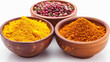 Turmeric and Mixed Peppercorns: Vibrant yellow turmeric powder spills from a wooden bowl, contrasting with whole mixed peppercorns in another bowl.