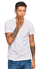 Poster - Young handsome african american man wearing casual white tshirt bored yawning tired covering mouth with hand. restless and sleepiness.