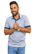 © Krakenimages.com - Handsome man with beard wearing casual clothes with hands together and crossed fingers smiling relaxed and cheerful. success and optimistic