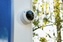 White CCTV Camera Camera On A Street ATM. Providing Security