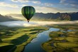 Aerial view of hot air balloon flying above verdant fields with ample room for text