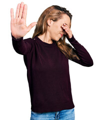 Sticker - Young caucasian woman wearing casual clothes covering eyes with hands and doing stop gesture with sad and fear expression. embarrassed and negative concept.