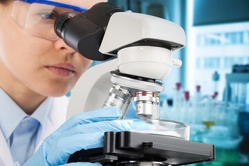 Sticker - Female scientist in the lab, using a microscope