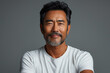 © Aaron Weiss - Portrait of a successful Asian man over 50 years old, with gray hair and beard, wearing a white T-shirt.