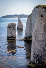 Tranquil Scene Of Rock Formations Located In A Body Of Water In Old Harry Rocks, Dorset, England