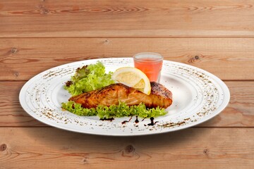 Wall Mural - Fried tasty fish dish with vegetable served on plate
