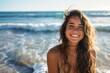 Portrait of a very happy young woman loving the life shes living having fun on the beach