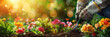 Gardener planting flowers in the soil with garden tools on a green bokeh background for a banner design with copy space for text.