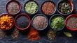 Illustrate an image focusing on a selection of superfoods like chia seeds, flax seeds, and spirulina powder, with each ingredient artistically placed in small bowls on a dark slate background.