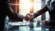 Close-up of business people shaking hands in office. Handshake concept.