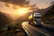 Cargo truck driving on winding road through mountain pass with sunset.