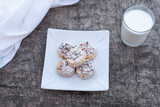 Fototapeta Boho - Freshly baked cookies on plate with glass of milk.