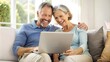 © PhotoPhreak - Happy Middle-Aged Couple Using Laptop