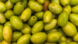 Pakistani jujubes in basket on table.Chinese date.Fresh jujubes. Fresh and delicious Pakistani jujube fruit with cut pulp. Jujube seed with jujube background.