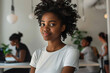 woman afro smiling in coworking space