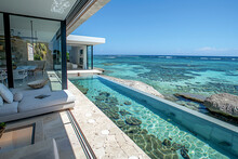 A Modern Beach Terrace With Transparent Flooring Showcasing The Ocean Life Underneath