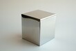 a shiny metal cube on a white surface