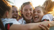 Group of young female athletes sport into euphoric celebration against the backdrop of the soccer pitch, a spirited.