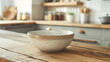 A ceramic bowl on a wooden kitchen table