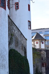 Wall Mural - castle walls with a small hut in background