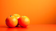 A single orange sits on a table with a wet surface.