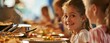 © neirfy - Happy child girl and other kids at buffet of cafeteria in elementary school or hotel.