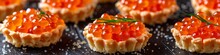 red caviar in tartlets.