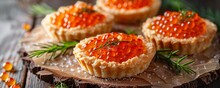 red caviar in tartlets.