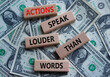 © Natallia - Actions speak louder than Words symbol. Wooden blocks with words Actions speak louder than Words. Beautiful dollar background. Business and Actions concept. Copy space.