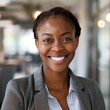 Smiling African American businesswoman 20-30 years old, active business woman against the background of her office