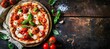 Freshly baked pizza with tomatoes, basil, and melted cheese on a rustic wooden table