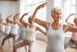 © Darya - Graceful Balance: Senior Woman Leading a Fitness Class with Poise