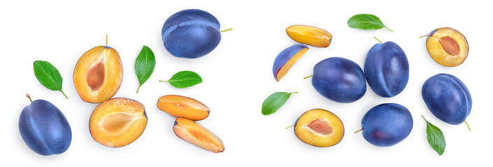 Wall Mural - fresh blue plum and half with leaves isolated on white background. Top view. Flat lay