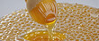Sweet golden honey isolated on white