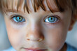 Close-up of a boy child with beautiful blue eyes