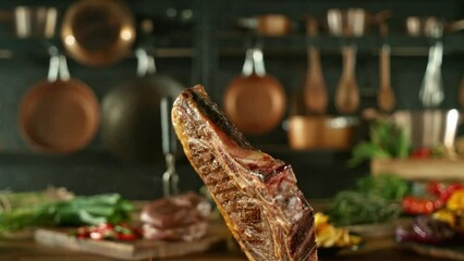 Wall Mural - Close-up of flying and rotating tasty beef steak in kitchen, super slow motion, filmed on high speed cinematic camera at 1000 fps. Camera movement.