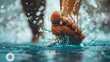 In a focused close-up, the relentless kicking of a swimmer's feet beneath the water's surface is revealed, illustrating the dynamic propulsion essential for speed in individual sports swimming.