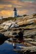 Pemaquid Lighthouse on the Maine coast in late afternoon, with a stormy sky,