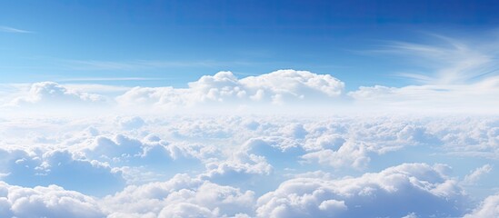 Wall Mural - a picturesque natural landscape with a fluid blue sky adorned with fluffy white cumulus clouds, crea