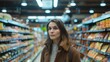 © progressman - a woman standing in a grocery store
