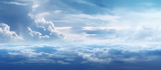 Wall Mural - the suns rays are breaking through the cumulus clouds in the blue sky, creating a stunning natural l