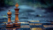 King and pawn chess pieces on a wet wood game board, close-up focus on pieces of a strategy in play