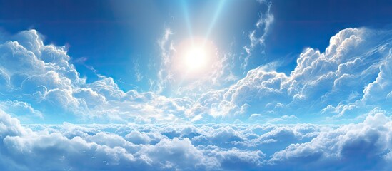 Wall Mural - the sun is peeking through the cumulus clouds in the electric blue sky, creating a picturesque natur