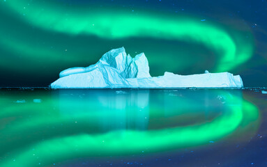 Wall Mural - iceberg floating in greenland fjord with aurora borealis - greenland