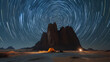 Whispers of Time: Desert Night - Star Trails Spin As a Tent Stands Watch