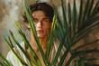 © Bargais - Boy with palm leaves in his hands. Palm sunday.