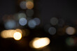 Blurred bokeh city lights, abstract night scene. Abstract high resolution full frame background with copy space.