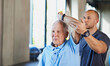 © peopleimages.com - Physiotherapist, helping and senior man with stretch, training and elderly support for care. Men, gym and exercise for health, wellness and coaching with arthritis for mature rehab and wellbeing