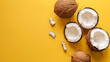 Coconuts and pieces scattered on a crisp yellow background.
