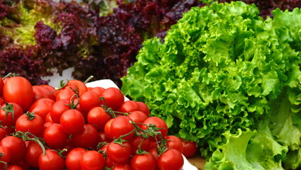 Wall Mural - Vegetables at City Market. Tomato and green salad...